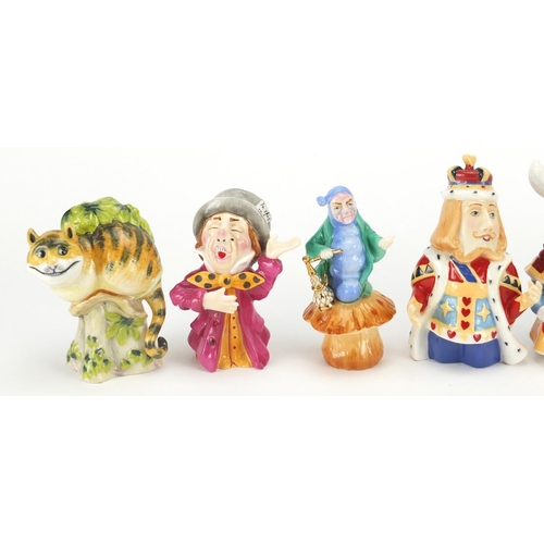 2616 - Set of eight Alice in Wonderland candle snuffers by Candle Crown Collections, the largest 10.5cm hig... 