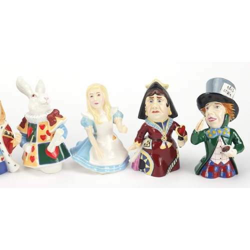 2616 - Set of eight Alice in Wonderland candle snuffers by Candle Crown Collections, the largest 10.5cm hig... 