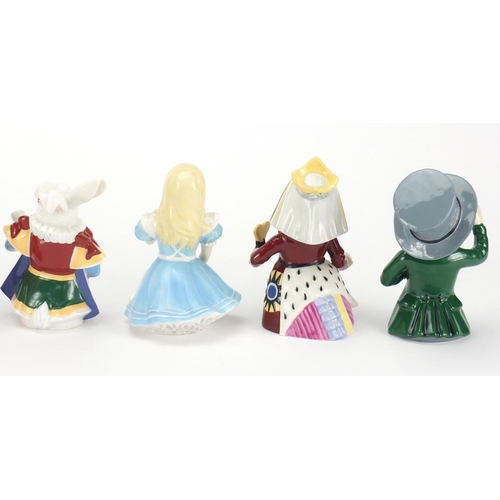 2616 - Set of eight Alice in Wonderland candle snuffers by Candle Crown Collections, the largest 10.5cm hig... 