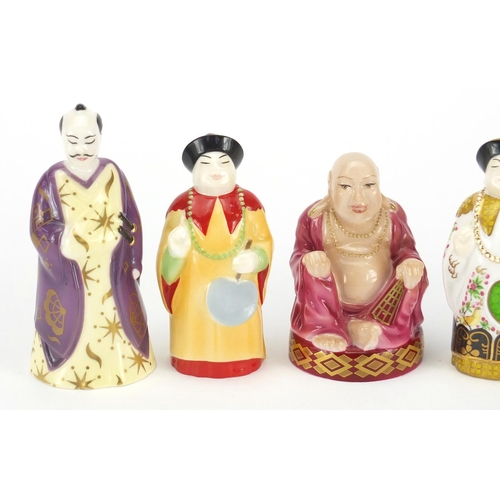 2595 - Five Royal Worcester candle snuffers comprising smiling Buddha, sleeping Buddha, samurai and two man... 