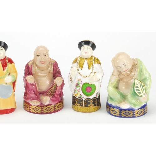 2595 - Five Royal Worcester candle snuffers comprising smiling Buddha, sleeping Buddha, samurai and two man... 