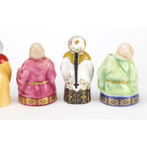 2595 - Five Royal Worcester candle snuffers comprising smiling Buddha, sleeping Buddha, samurai and two man... 