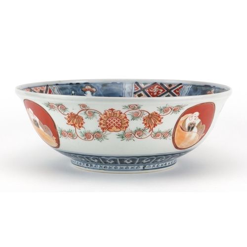 499 - Japanese Imari porcelain bowl, hand painted with four figures, mythical animal and Buddha's, 25cm in... 