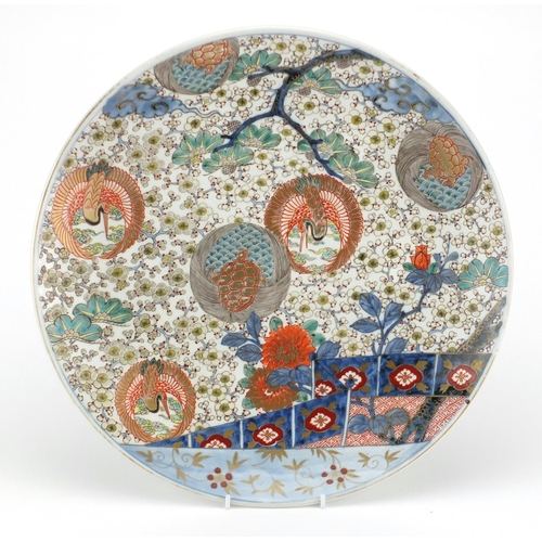 496 - Good Japanese Imari porcelain charger, finely hand painted with roundels of cranes and tortoises amo... 