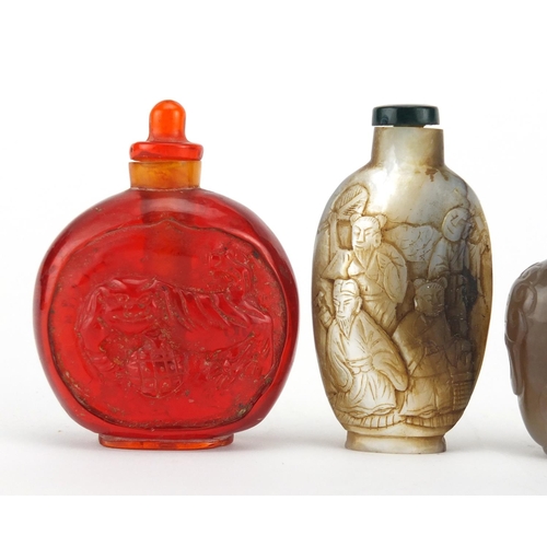 539 - Three Chinese snuff bottles comprising a mother of pearl example carved with figures an agate exampl... 