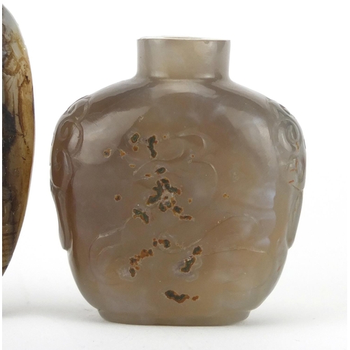 539 - Three Chinese snuff bottles comprising a mother of pearl example carved with figures an agate exampl... 