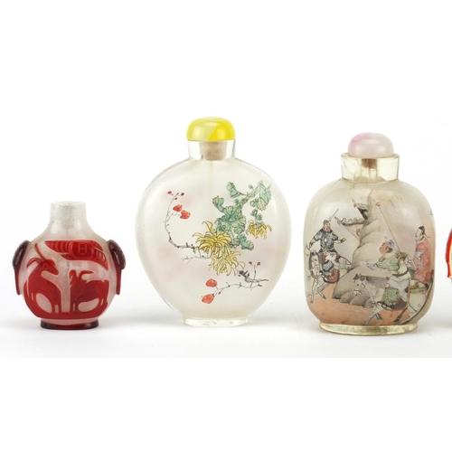 535 - Five Chinese glass snuff bottles comprising a Peking example and four others internally hand painted... 