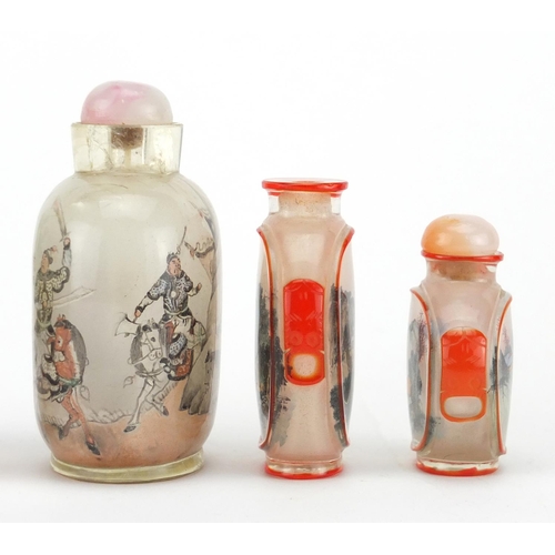 535 - Five Chinese glass snuff bottles comprising a Peking example and four others internally hand painted... 