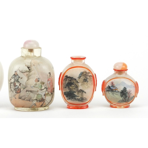 535 - Five Chinese glass snuff bottles comprising a Peking example and four others internally hand painted... 