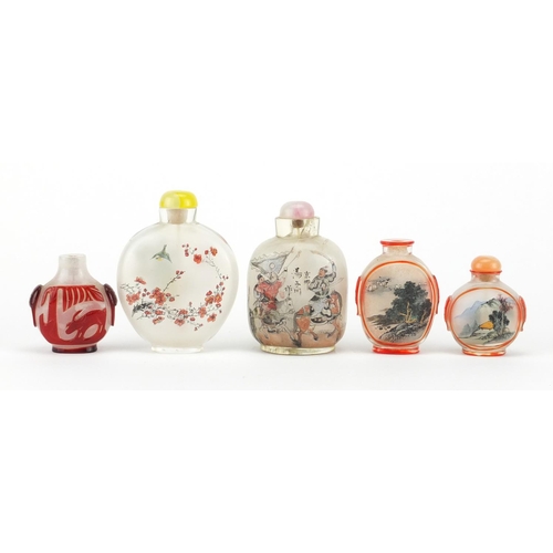 535 - Five Chinese glass snuff bottles comprising a Peking example and four others internally hand painted... 