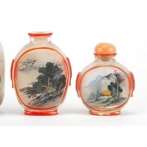 535 - Five Chinese glass snuff bottles comprising a Peking example and four others internally hand painted... 