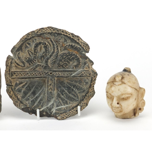 649 - Antiquities comprising an Indian white hardstone head and two green stone carvings, the largest 13cm... 