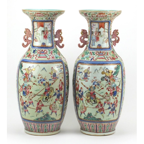 399 - Large pair of Chinese Canton porcelain vases with twin handles, each hand painted in the famille ros... 