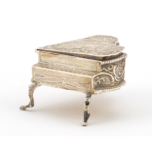 844 - Novelty silver trinket box in the form of a grand piano, the hinged lid embossed with putti, W N Bir... 