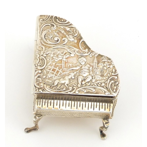 844 - Novelty silver trinket box in the form of a grand piano, the hinged lid embossed with putti, W N Bir... 
