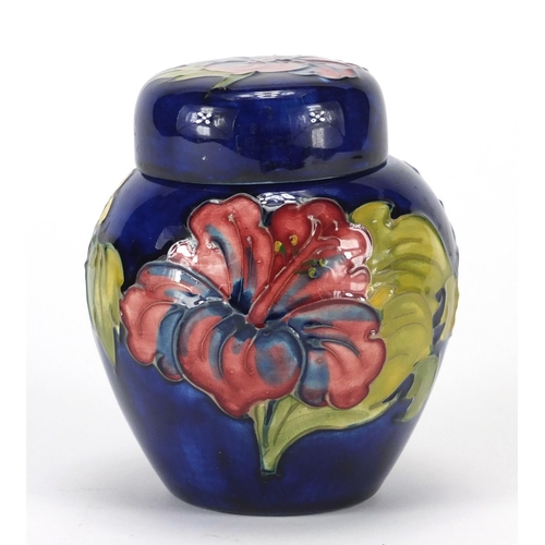 753 - Moorcroft pottery jar and cover, hand painted and tube lined in the anemone pattern, impressed marks... 