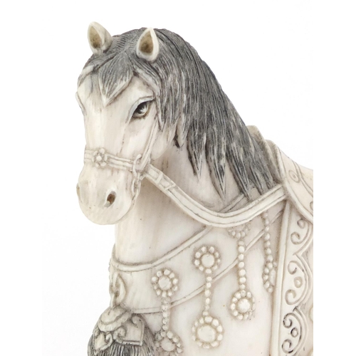 516 - Good pair of Chinese carved ivory horses, raised on shaped carved hardwood stands with silver colour... 