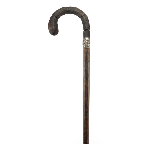 113 - Bamboo walking stick with carved horn handle and silver collar, possibly rhinoceros horn, indistinct... 