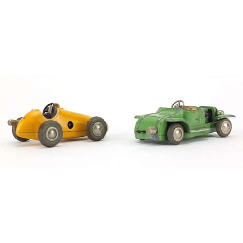152 - Two Schuco micro-racer clock work cars with boxes, comprising numbers 1036 and 1040