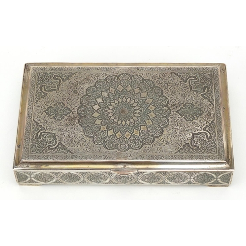 627 - Rectangular Persian silver cigarette box engraved with foliate motifs, the hinged lid opening to rev... 