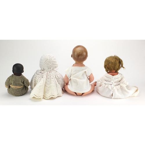 149 - Four antique dolls including two with bisque heads comprising Armand Marseille and a black Heinrich ... 