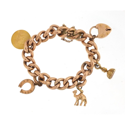 921 - Victorian 15ct rose gold bracelet with three gold charms and a George III half sovereign, approximat... 