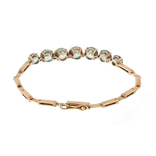 936 - 14ct gold graduated blue zircon bracelet, 15cm in length, approximate weight 8.8g