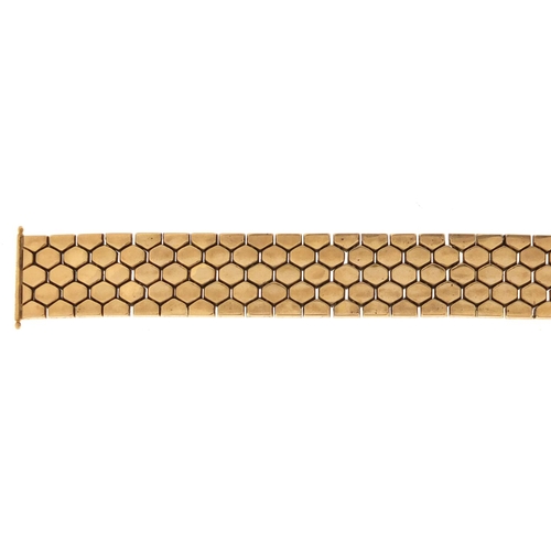 944 - Unmarked gold flattened link bracelet, 20cm in length x 2cm wide, approximate weight 65.5g