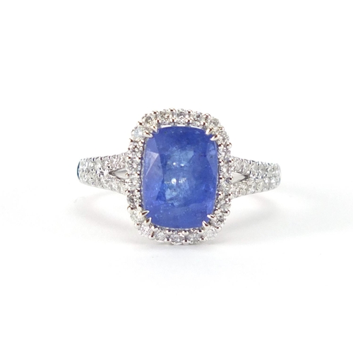 913 - 18ct white gold tanzanite and diamond ring, size N, approximate weight 5.7g