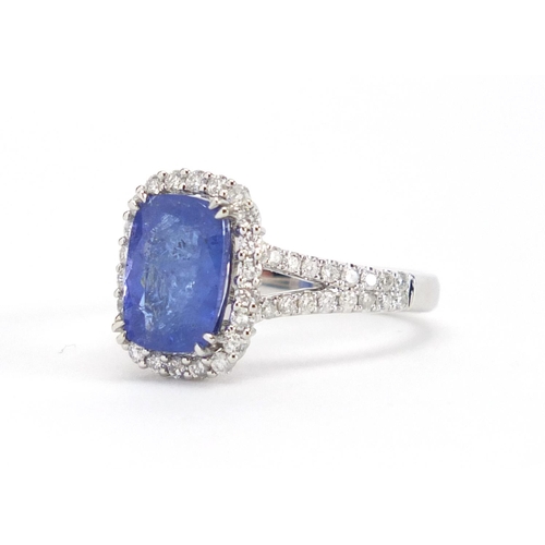 913 - 18ct white gold tanzanite and diamond ring, size N, approximate weight 5.7g