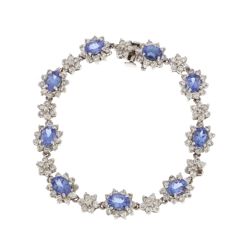 924 - 18ct white gold tanzanite and diamond bracelet, 17cm in length, approximate weight 22.2g,  with insu... 