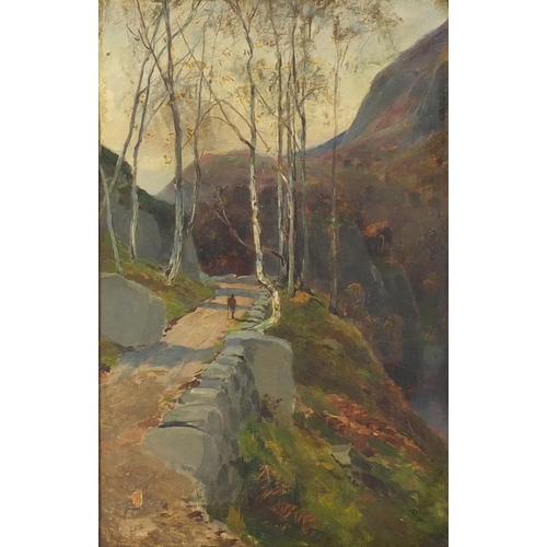2244 - Figure on a path in a mountainous landscape, oil on panel, bearing an indistinct signature to the lo... 
