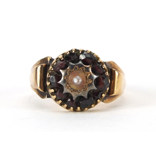 938 - Victorian unmarked gold pearl and garnet ring, size O, approximate weight 5.2g