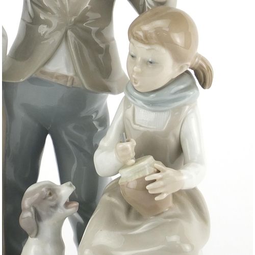 2286 - Lladro figure group of three figures and a dog, 25cm high