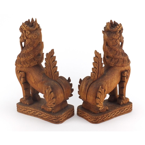 2355 - Pair of Balinese carved wood dragons, each 31.5cm high