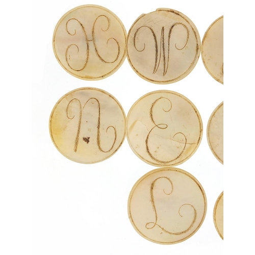 49 - Set of ten Georgian mother of pearl buttons carved with initials, each 4cm in diameter