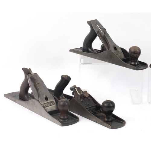 181 - Six vintage Stanley wood working planes comprising two No.5's, No.5a, two No.5½ and a No.G6