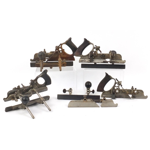 173 - Four vintage Stanley No.45 wood working combination planes, one with original crate