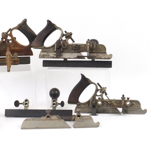 173 - Four vintage Stanley No.45 wood working combination planes, one with original crate