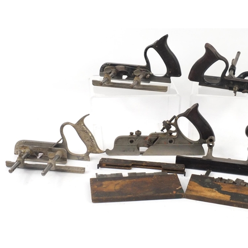 174 - Five vintage Stanley wood working combination planes comprising one No.45, one No.46 and three No.50... 
