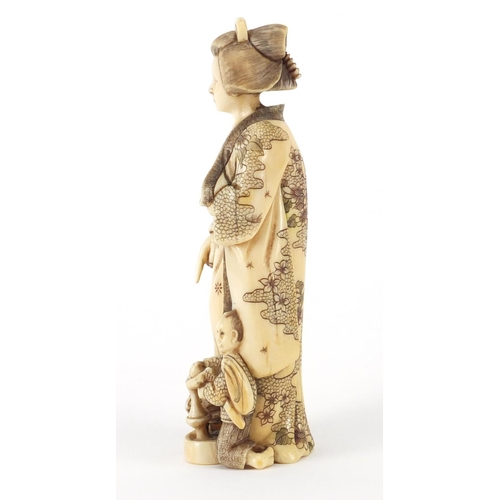 521 - Japanese carved ivory okimono of a Geisha girl with child, 13.5cm high