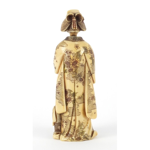 521 - Japanese carved ivory okimono of a Geisha girl with child, 13.5cm high