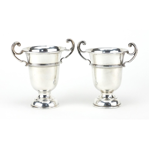 859 - Pair of silver twin handled trophies, by A E Poston & Co Limited, Birmingham 1937, 12cm high, approx... 