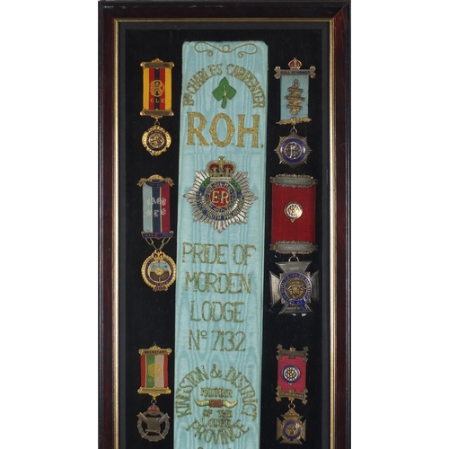 254 - Royal Order of Buffalo jewels and sash, housed in a glazed display, relating to Charles W Carpenter ... 