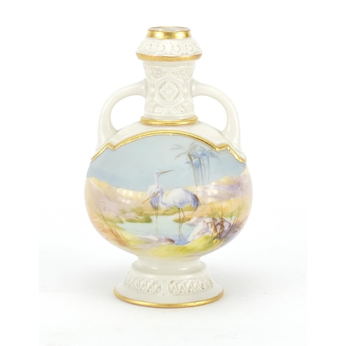 694 - Royal Worcester porcelain vase with twin handles, hand painted with a stork in water, factory marks ... 