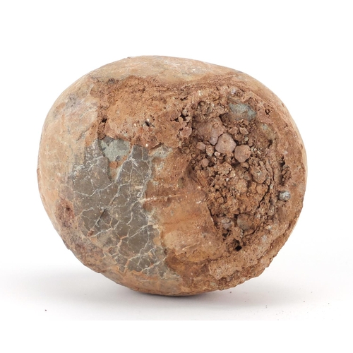 23 - Prehistoric fossilised dinosaur egg, 11cm H x 15cm W x 13cm D