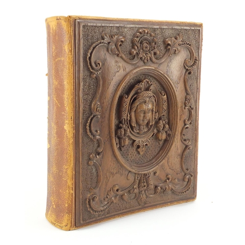 299 - Good 19th century carved blackforest album with hand painted pages housing photographs of famous peo... 