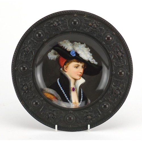 720 - 19th century continental porcelain plate, hand painted with a portrait of a young female, housed in ... 