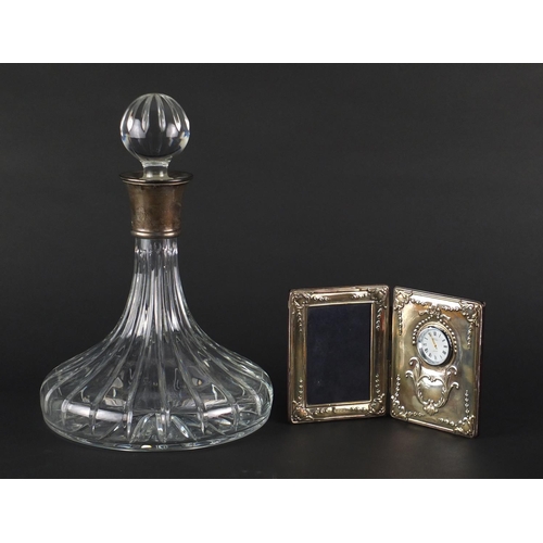 2257 - Cut glass ships decanter with silver collar and a silver frame/clock, both by Carrs, the largest 28c... 