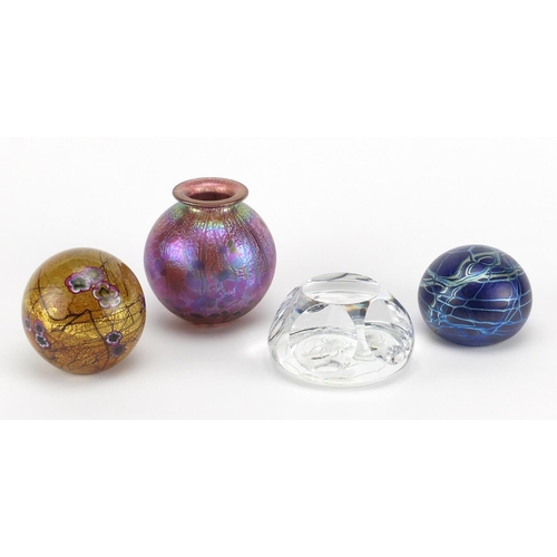 2214 - Glassware comprising a Norman Stuart Clarke iridescent paperweight, Isle of Wight vase and paperweig... 